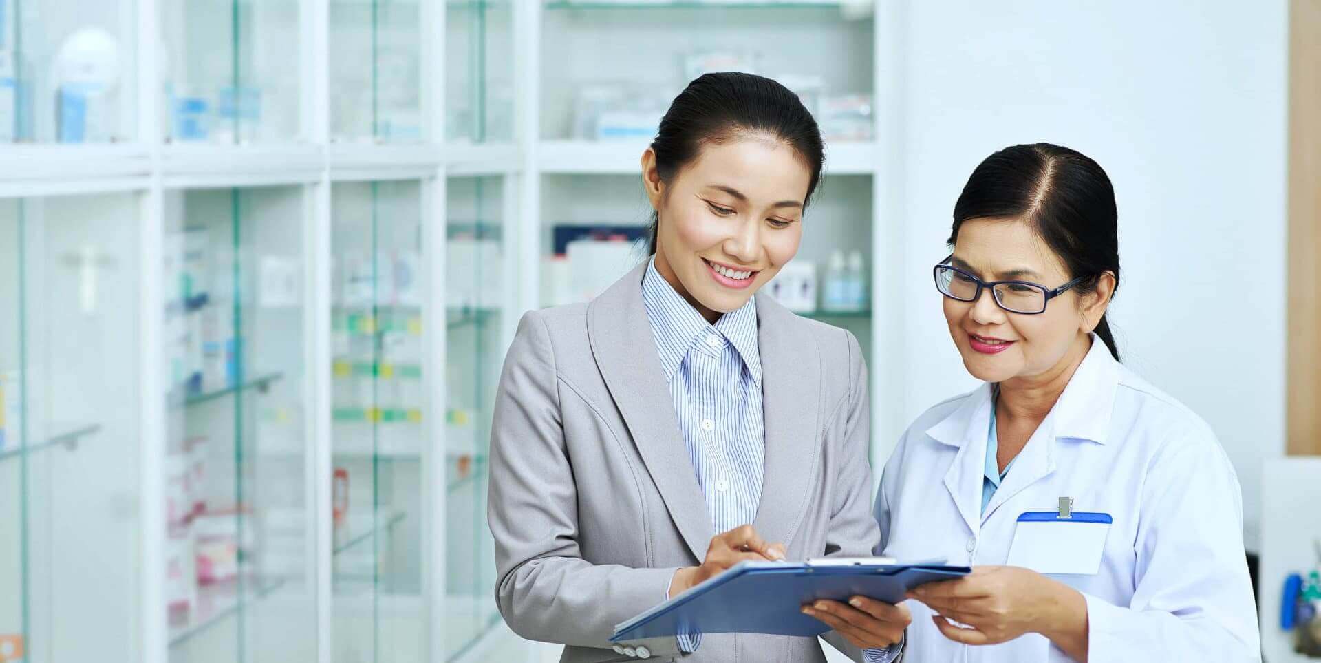 lady in suit and pharmacist